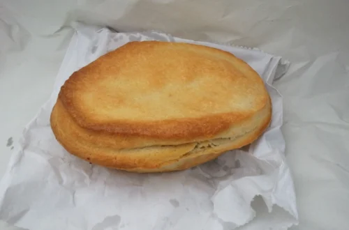 The Image shows a Clarks Pie On a White plateThere are few foods more synonymous with Cardiff’s working-class history than the humble Clarks Pie. Also known affectionately as a 'Clarkie', this hearty, gravy-filled meat pie has long held legendary status in the capital and beyond. It’s more than a snack—it’s a piece of South Wales history.