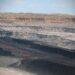 An open cast mine showing the deep coal seam